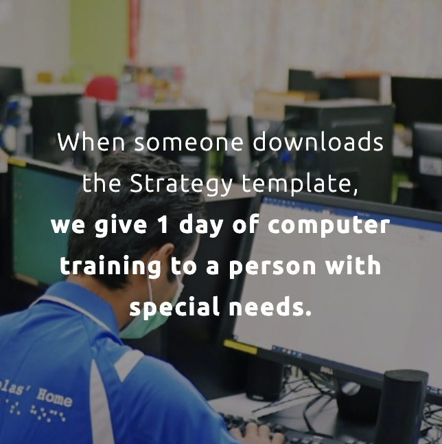 Image of someone using a computer. Text on top says ' When someone downloads the Strategy template, we give 1 day of computer training to a person with special needs.'